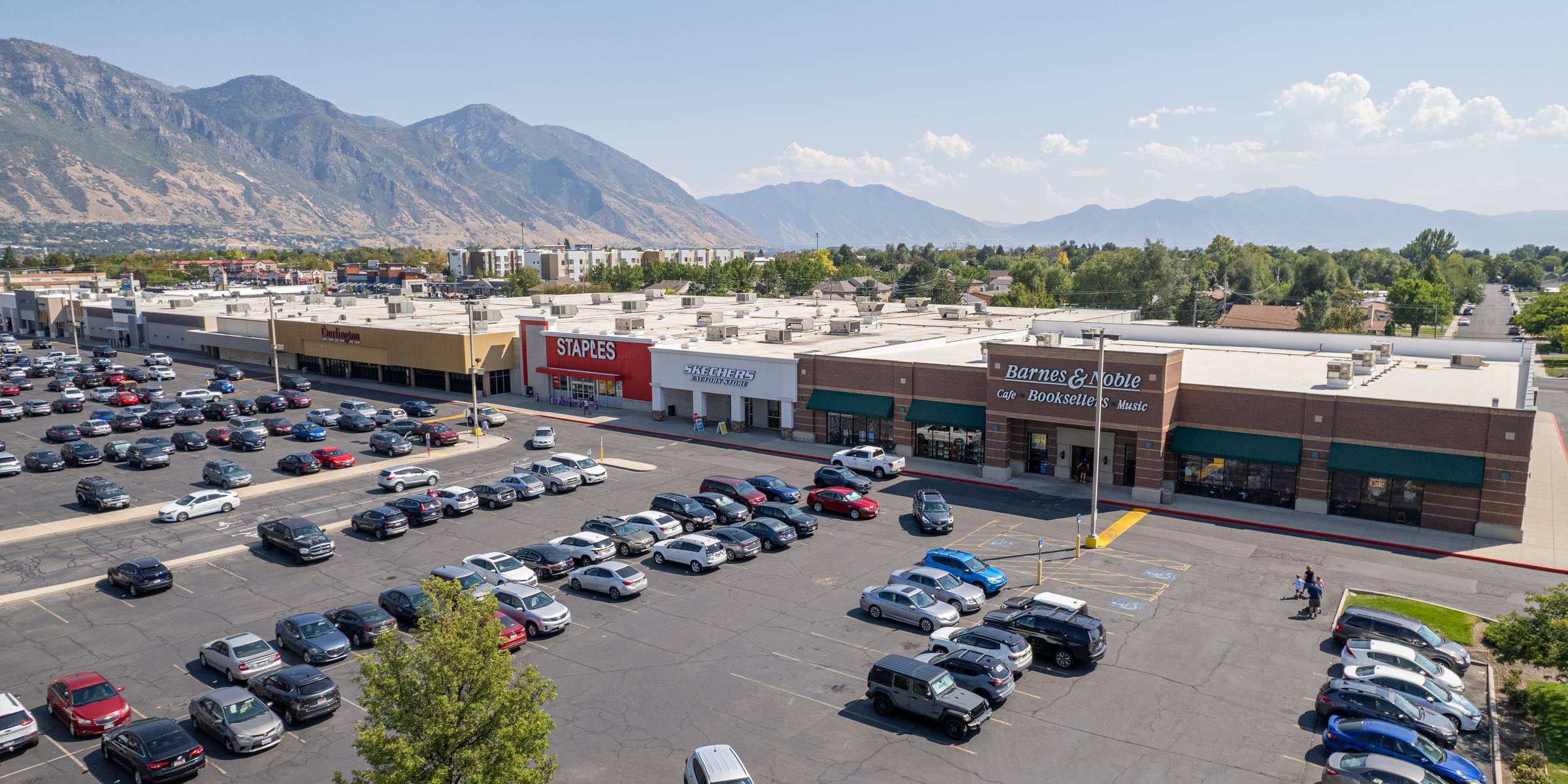 Aerial view of University Crossing shopping center in Orem, Utah, with the Wasatch Mountains behind